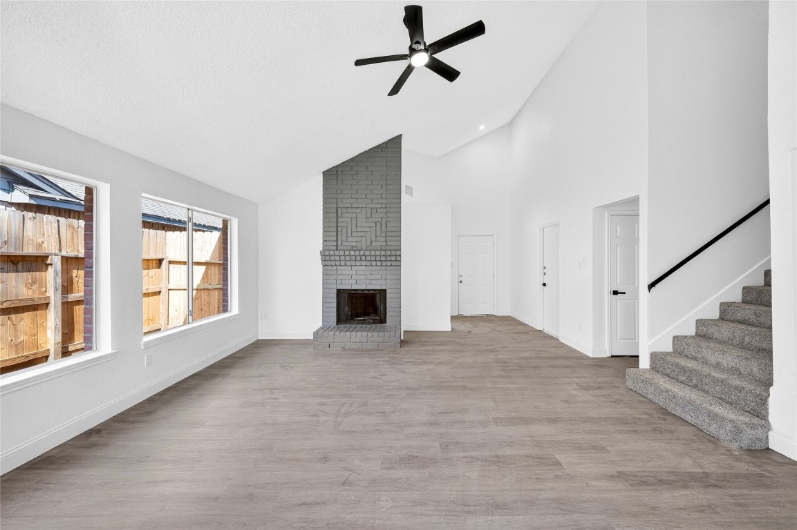 24007 Landing Way Drive Spring, TX 77373 - Photo 7 of 44 a view of an empty room with wooden floor and a window