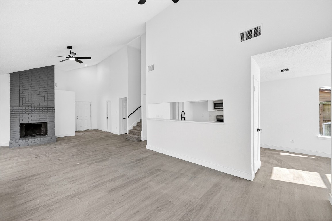 24007 Landing Way Drive Spring, TX 77373 - Photo 8 of 44 a view of a room with wooden floor and a ceiling fan
