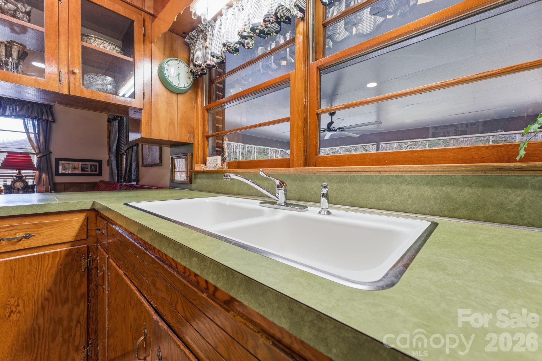 504 Greens Creek Road Sylva, NC 28779 - Photo 12 of 47 a bathroom with a sink and a large window