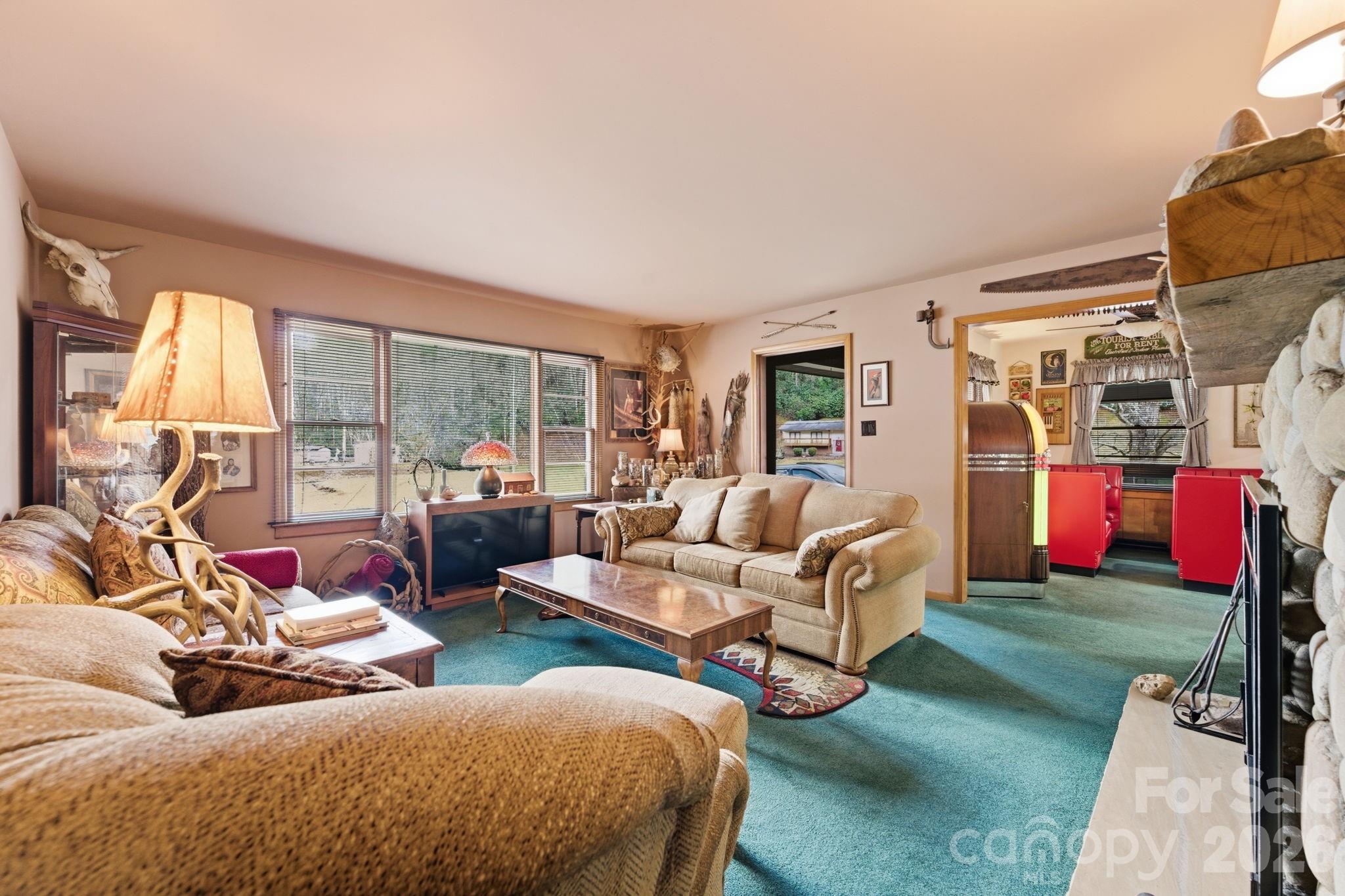504 Greens Creek Road Sylva, NC 28779 - Photo 21 of 47 a living room with furniture lamp and a large window