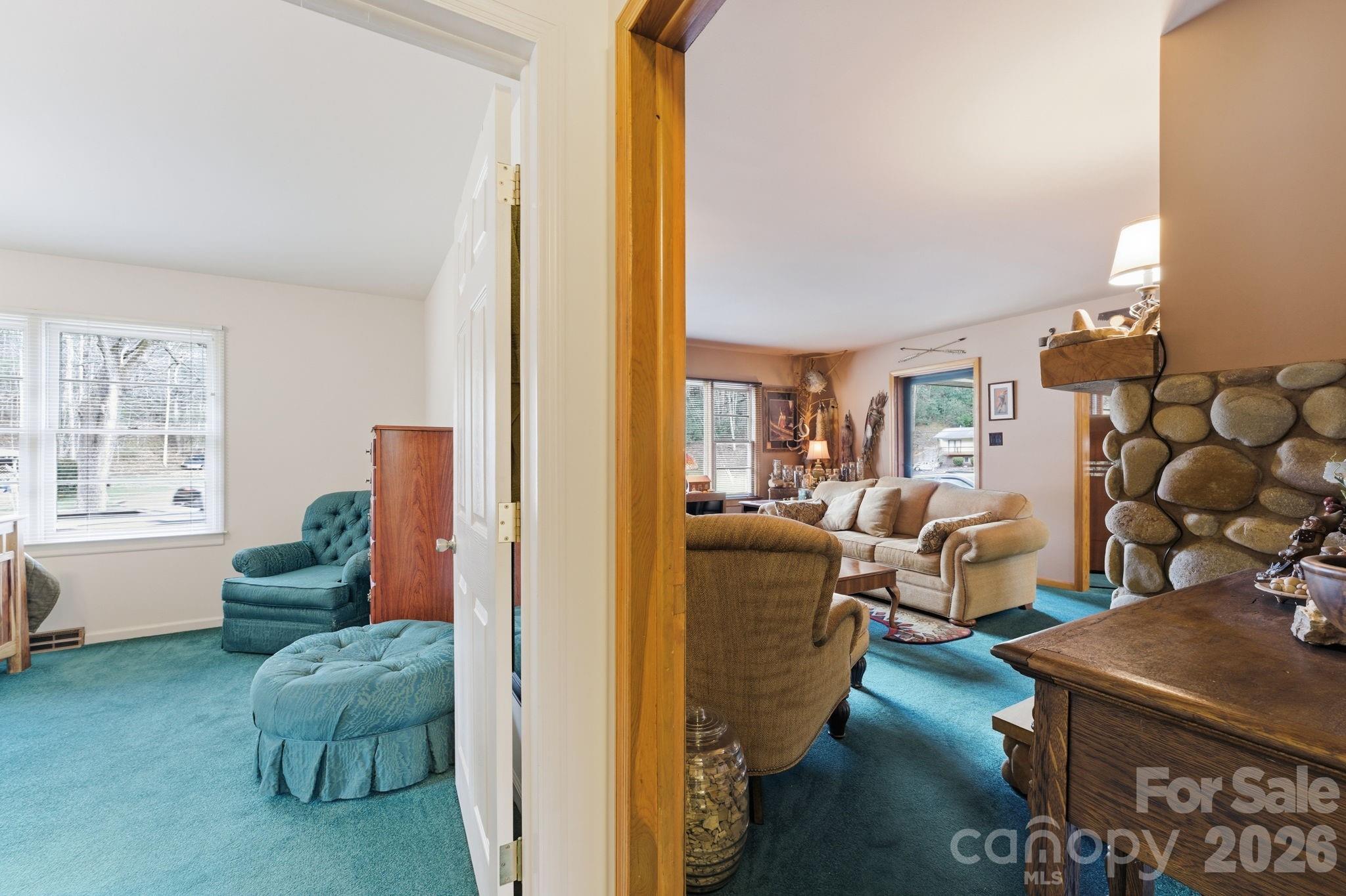504 Greens Creek Road Sylva, NC 28779 - Photo 22 of 47 a living room with furniture and a large window