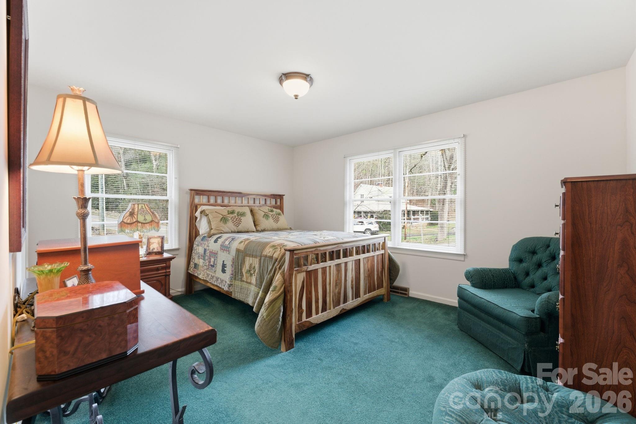 504 Greens Creek Road Sylva, NC 28779 - Photo 23 of 47 a bedroom with a bed and a couch