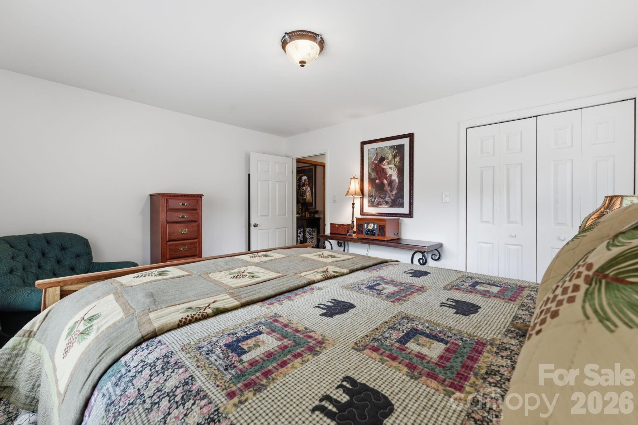 504 Greens Creek Road Sylva, NC 28779 - Photo 25 of 47 a bed sitting in a bedroom and bedroom