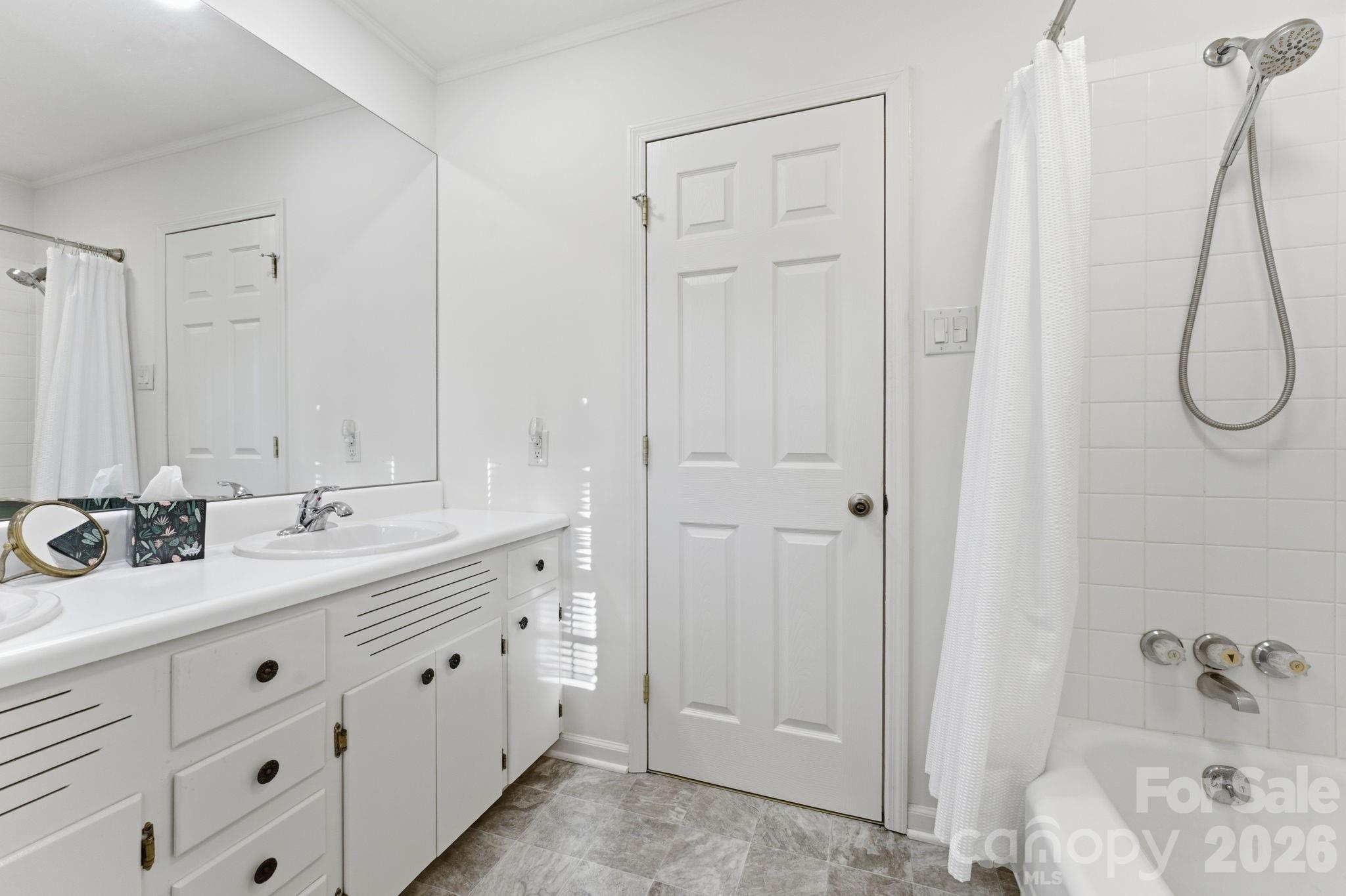 504 Greens Creek Road Sylva, NC 28779 - Photo 26 of 47 a bathroom with a double vanity sink and mirror