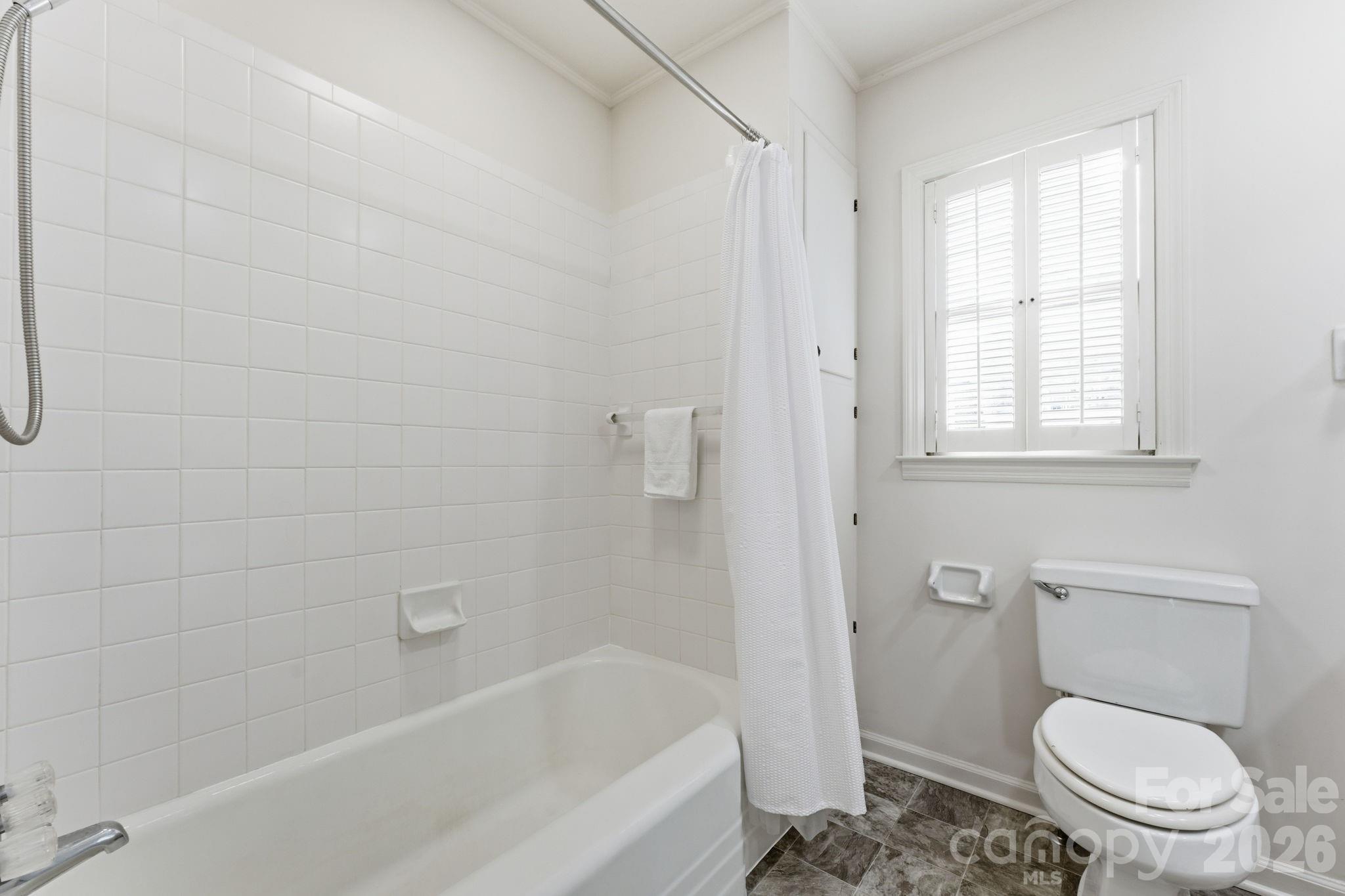 504 Greens Creek Road Sylva, NC 28779 - Photo 27 of 47 a white toilet sitting next to a bath tub