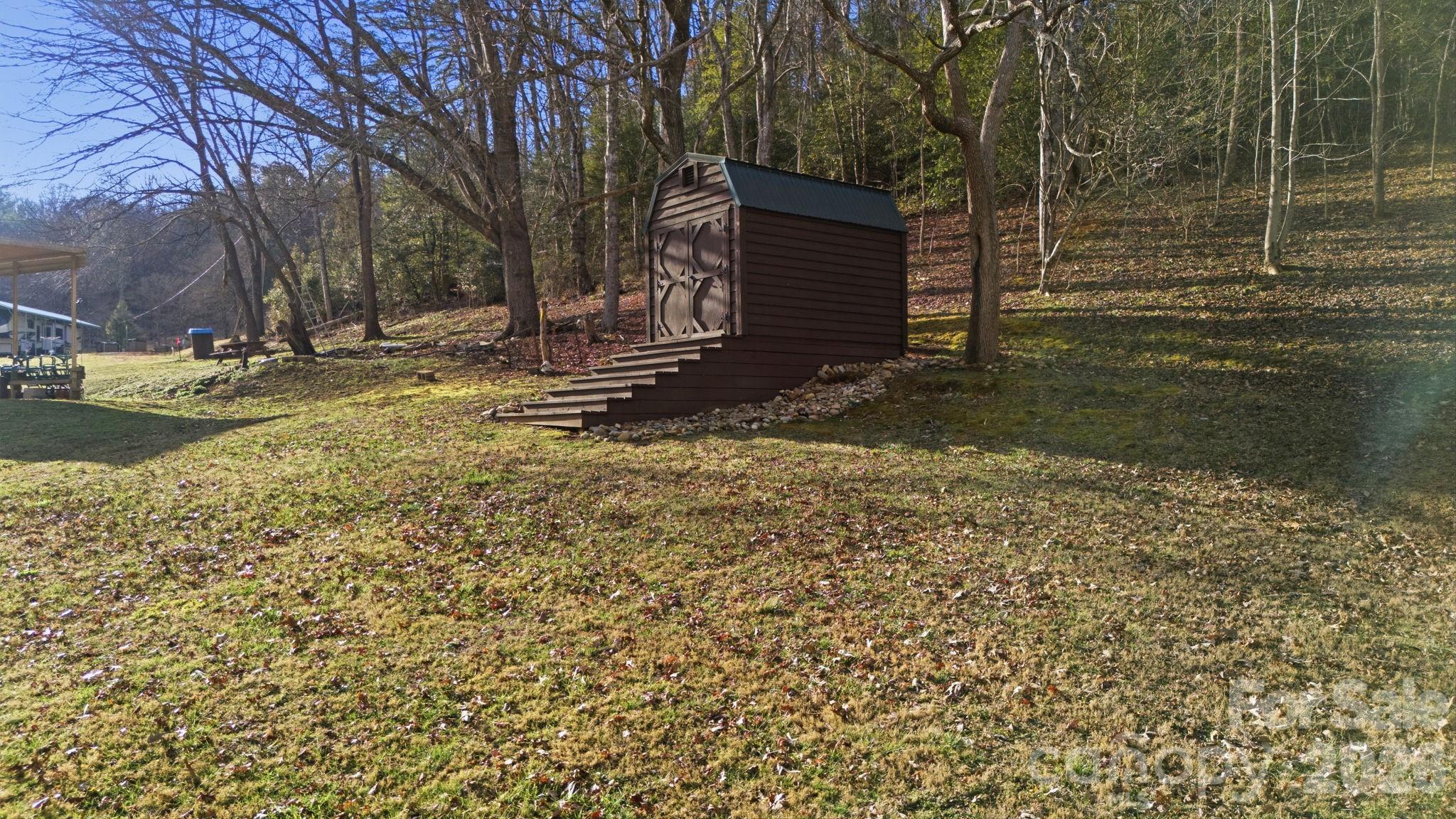 504 Greens Creek Road Sylva, NC 28779 - Photo 4 of 47 a view of a backyard with wooden fence