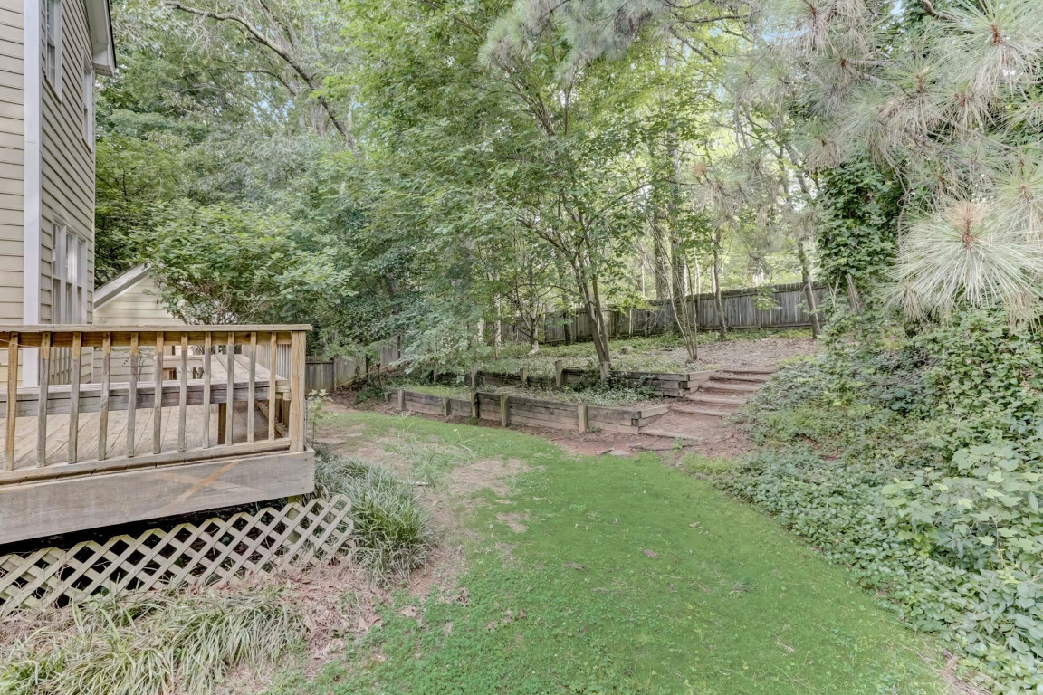 1601 Lethbridge Court Raleigh, NC 27606 - Photo 16 of 17 a view of a yard with wooden fence