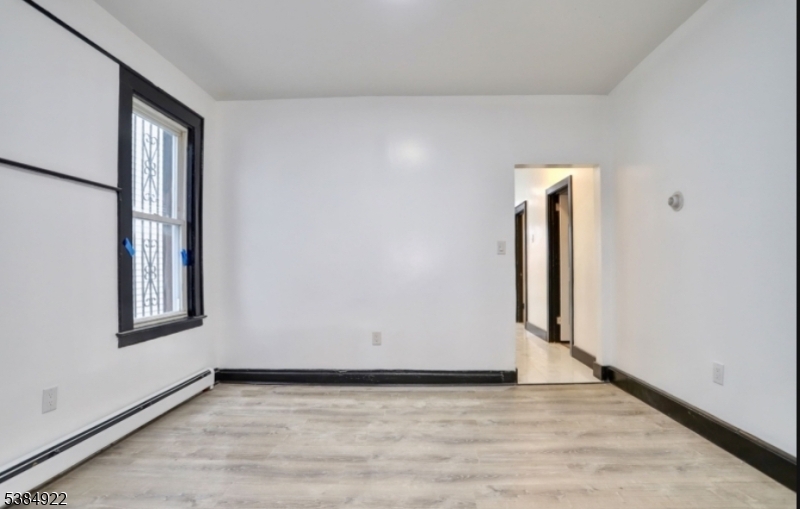 445 South 15th Street Newark, NJ 07103 - Photo 2 of 5 an empty room with window