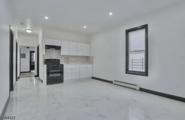 a kitchen with stainless steel appliances a refrigerator sink and stove