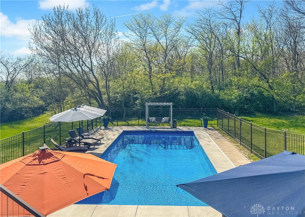 4096 Middle Urbana Road Urbana, OH 43078 - Photo 91 of 96 This tranquil backyard offers a refreshing pool, surrounded by nature for ultimate relaxation.