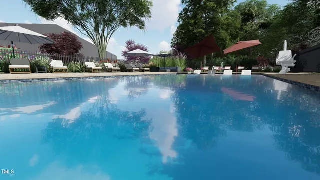 a swimming pool with outdoor seating and yard