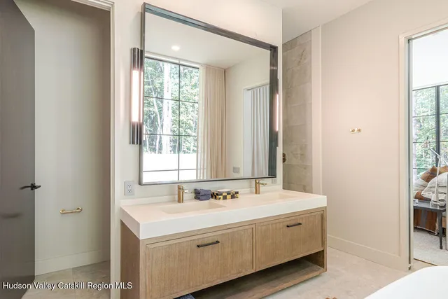 a view of a lake in middle of a field