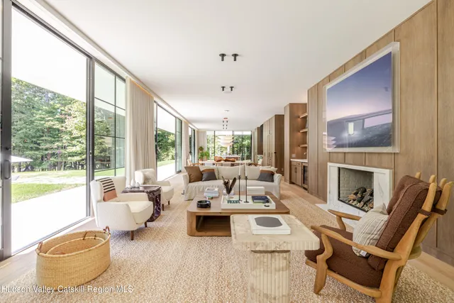 a white bath tub sitting in a bathroom next to a window
