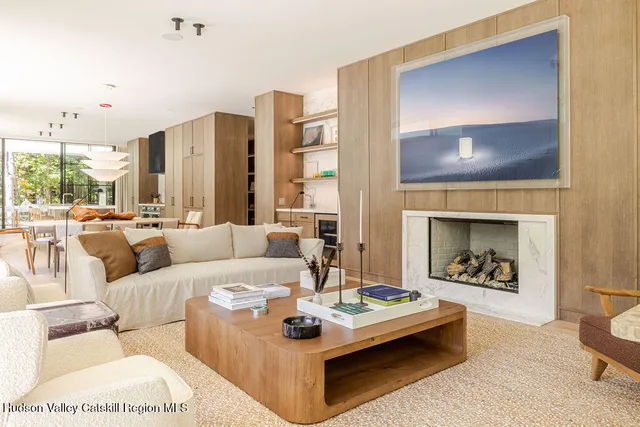 a bathroom with a granite countertop sink and a shower