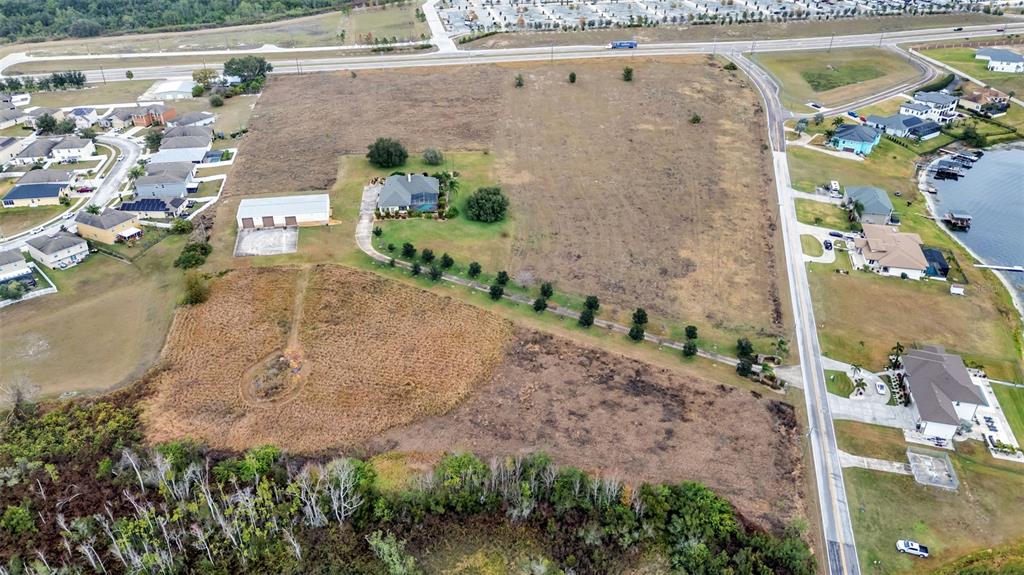 0 Old Berkley Road Auburndale, FL 33823 - Photo 5 of 6 an aerial view of a house with a yard and a large tree