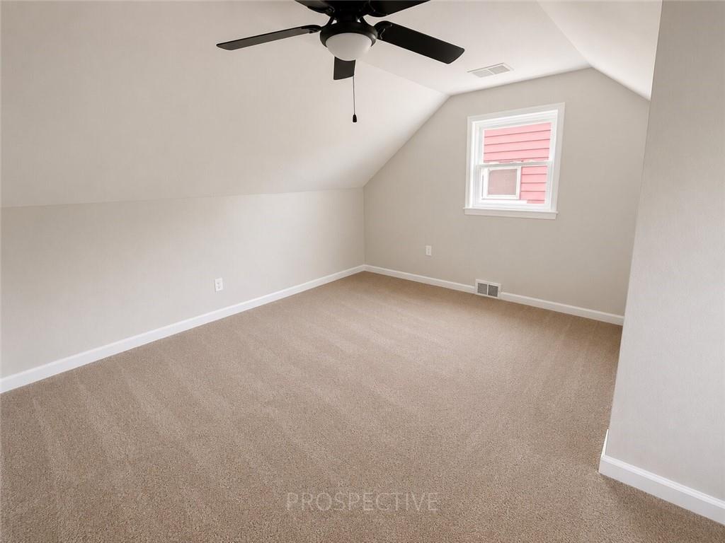 3079 Mt Troy Road Pittsburgh, PA 15212 - Photo 21 of 30 an empty room with a window and a ceiling fan
