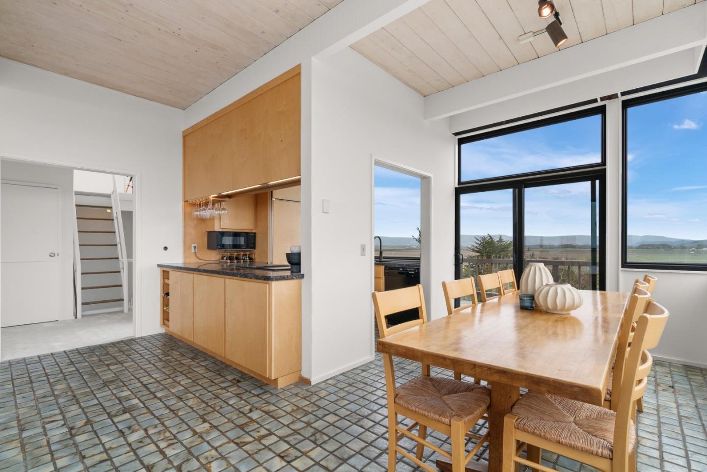 64 Avocet Circle Watsonville, CA 95076 - Photo 29 of 91 a open kitchen with stainless steel appliances granite countertop a refrigerator a stove a oven with white cabinets and glass table