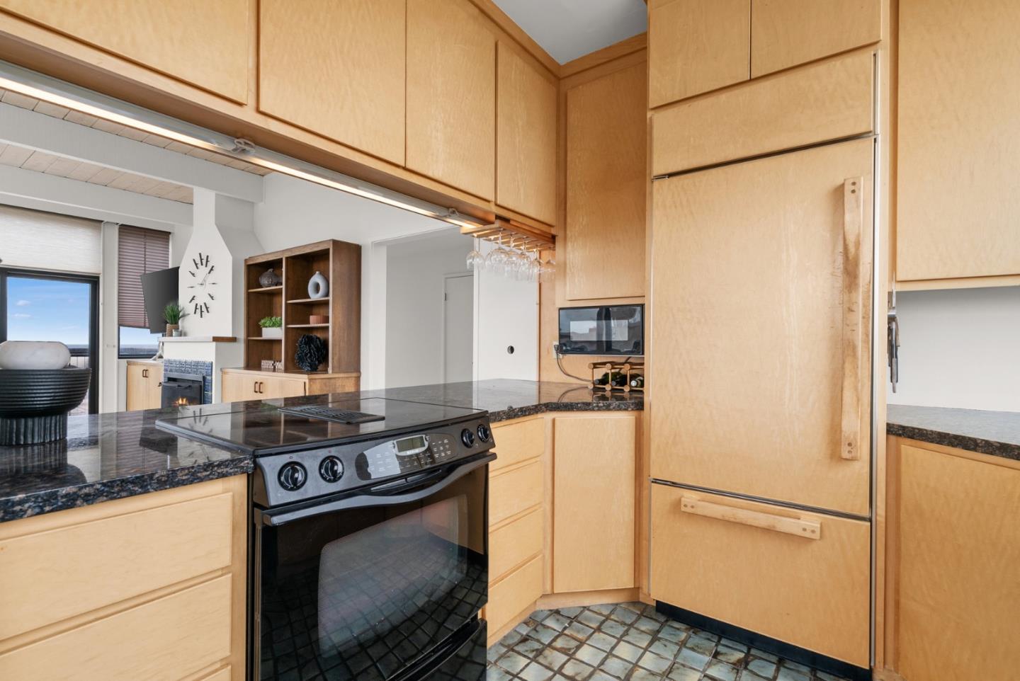 64 Avocet Circle Watsonville, CA 95076 - Photo 33 of 91 a kitchen with stainless steel appliances granite countertop a refrigerator a stove and a sink with wooden floor