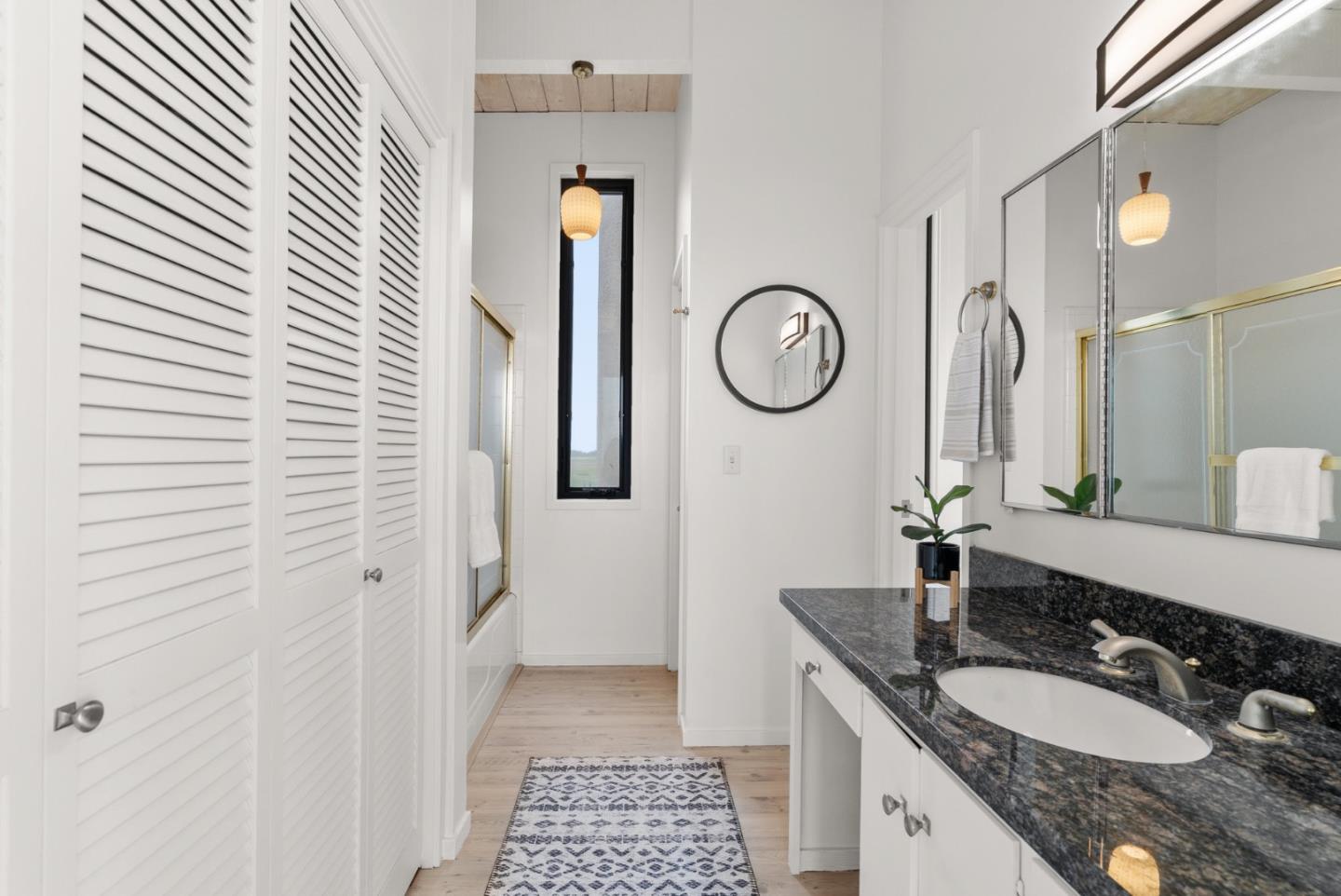 64 Avocet Circle Watsonville, CA 95076 - Photo 49 of 91 a bathroom with a granite countertop sink and a mirror