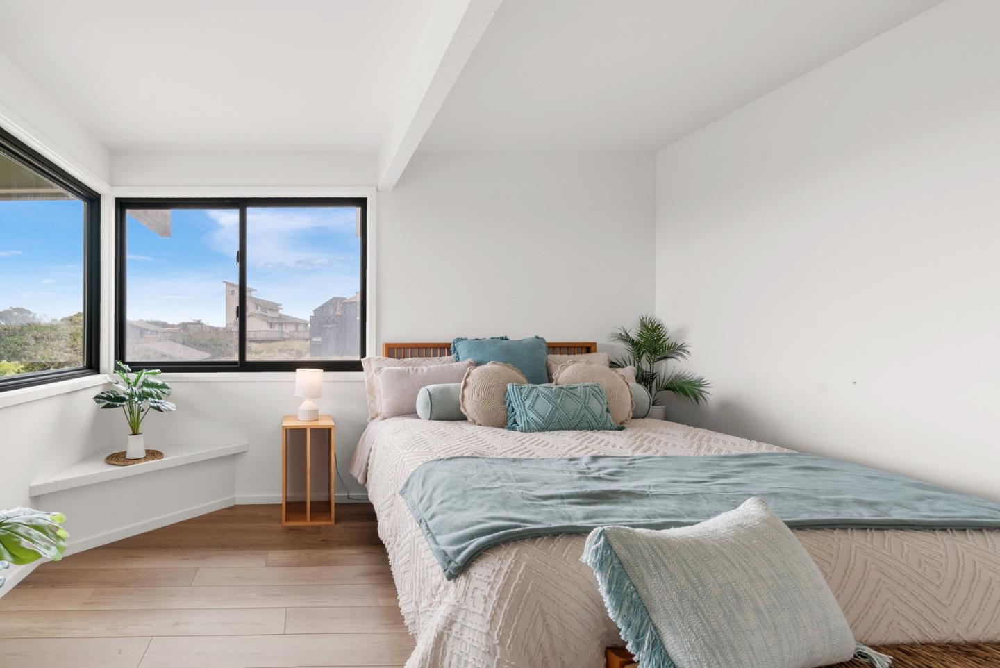 64 Avocet Circle Watsonville, CA 95076 - Photo 59 of 91 a bedroom with a large bed and a large window