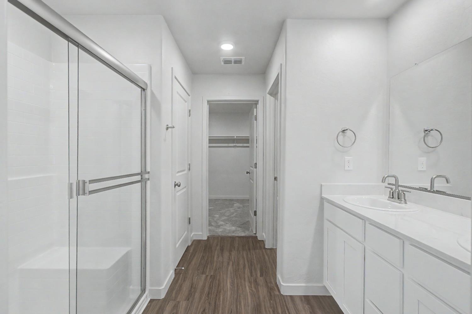 4119 Anise Court Merced, CA 95348 - Photo 11 of 27 a bathroom with a sink and mirror