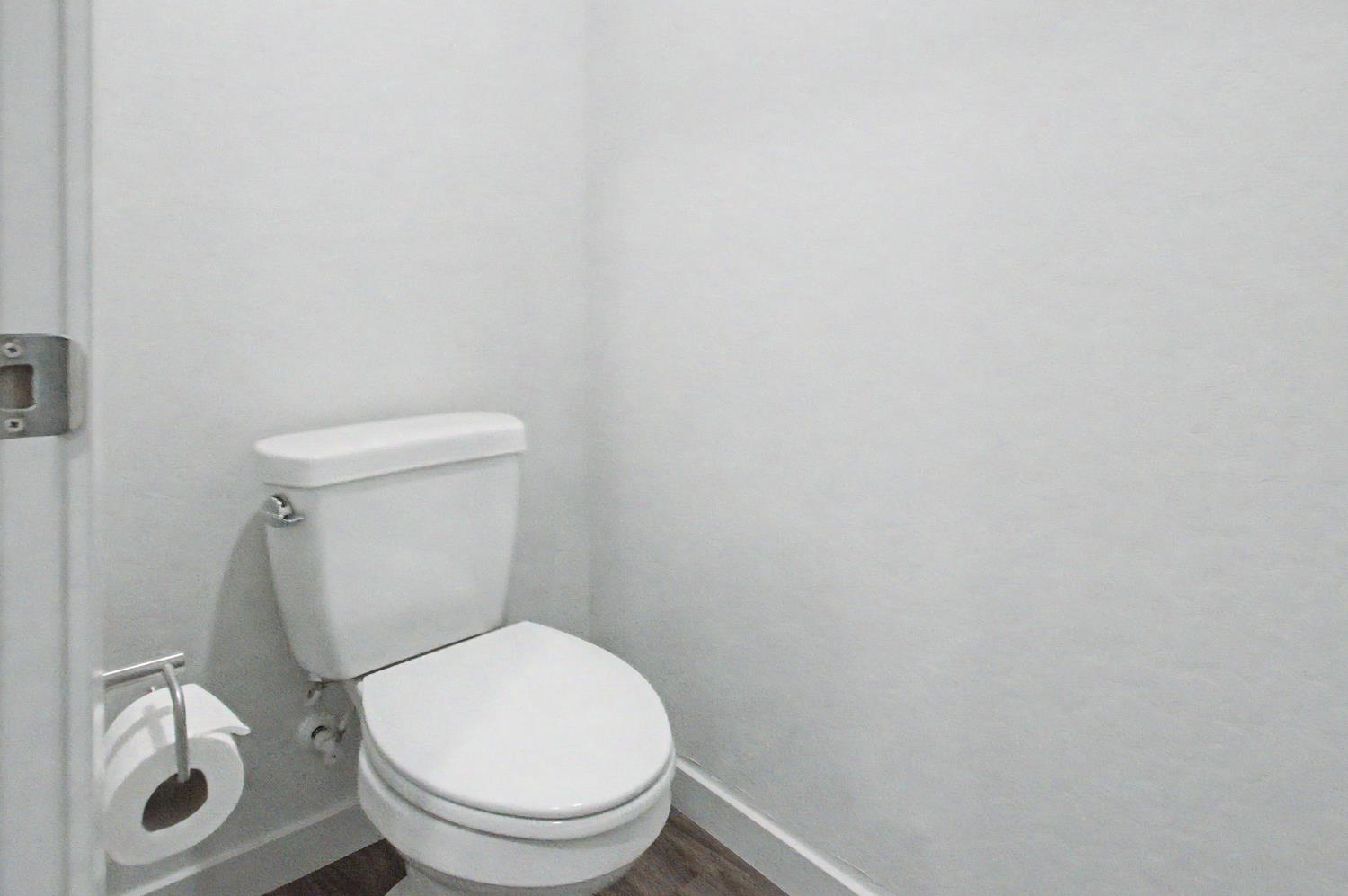 4119 Anise Court Merced, CA 95348 - Photo 13 of 27 a white toilet sitting next to a white sink