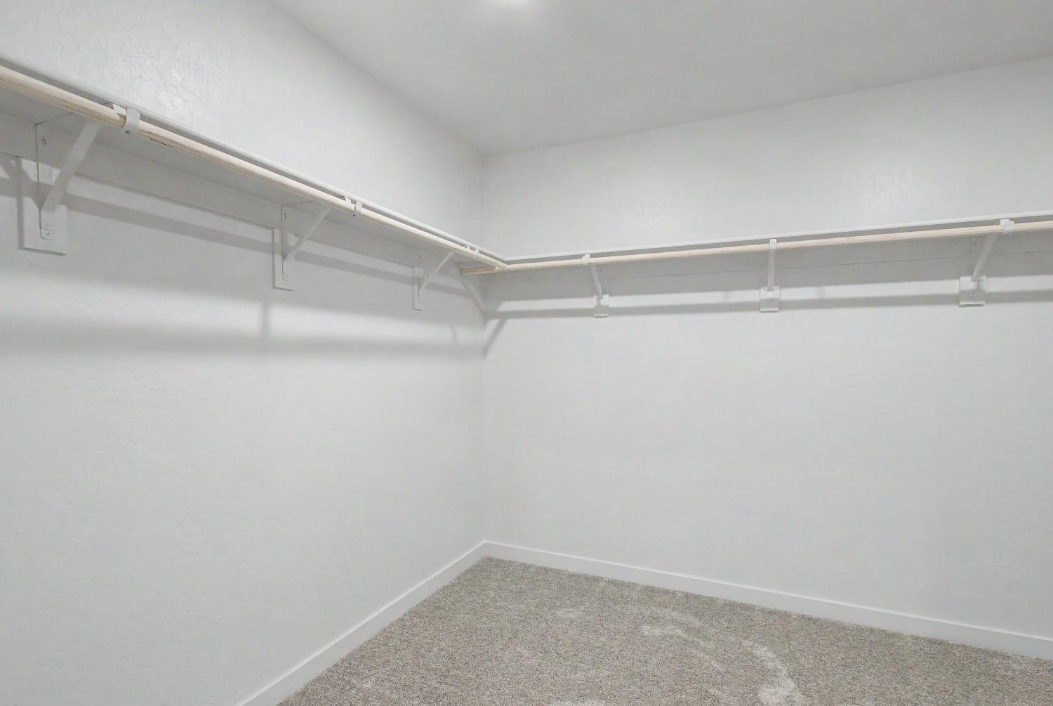 4119 Anise Court Merced, CA 95348 - Photo 14 of 27 a view of an empty walk in closet