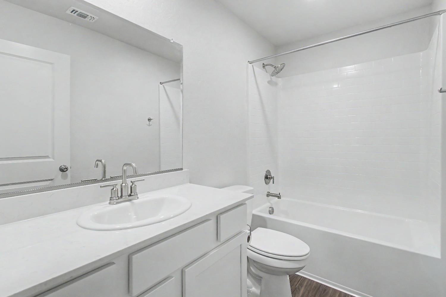 4119 Anise Court Merced, CA 95348 - Photo 18 of 27 a bathroom with a sink toilet and a mirror