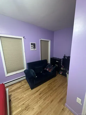 a view of a dining room with furniture and a wooden floor