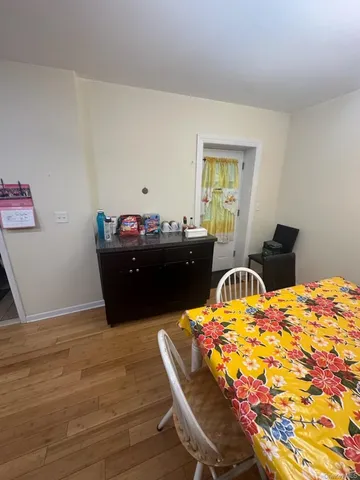 a living room with furniture rug and wooden floor