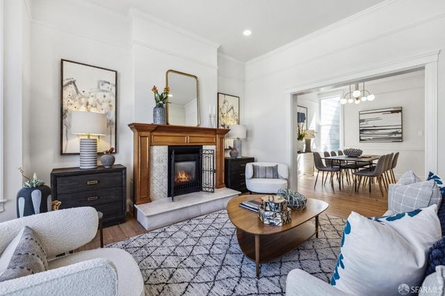 a view of a dining room with furniture and wooden floor