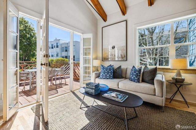 a kitchen with stainless steel appliances a stove a sink and a refrigerator