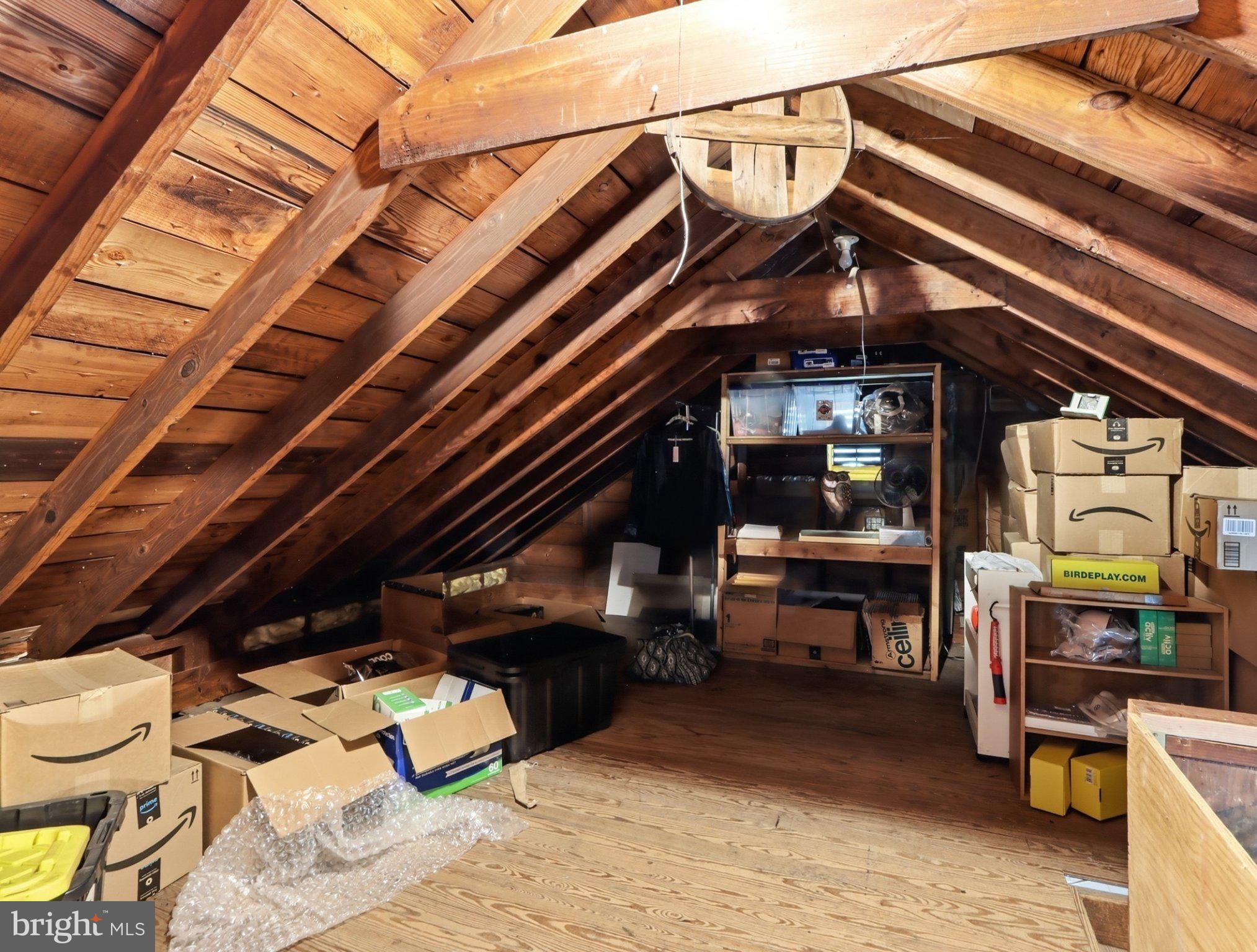 8176 Lea Road Pasadena, MD 21122 - Photo 16 of 23 Cozy attic space with wooden beams.