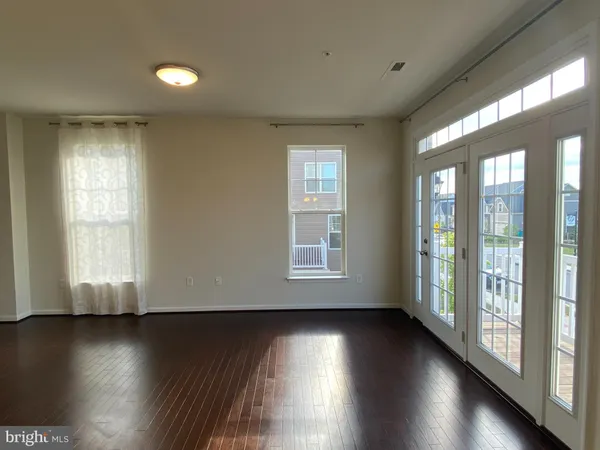 a view of entryway with stairs and wooden floor