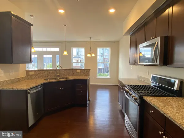 a view of a livingroom with furniture wooden floor and cabinet