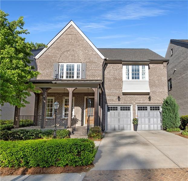 6454 Meridian Way Atlanta, GA 30328 - Photo 1 of 63 a front view of a house with garden