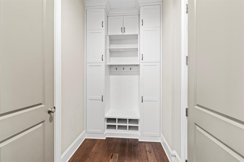 6454 Meridian Way Atlanta, GA 30328 - Photo 17 of 63 a view of walk in closet with empty racks