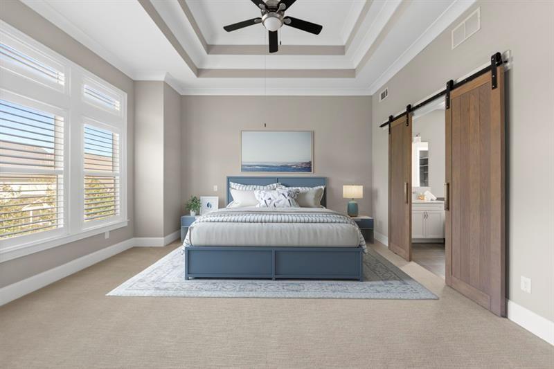 6454 Meridian Way Atlanta, GA 30328 - Photo 22 of 63 a spacious bedroom with a bed and a window