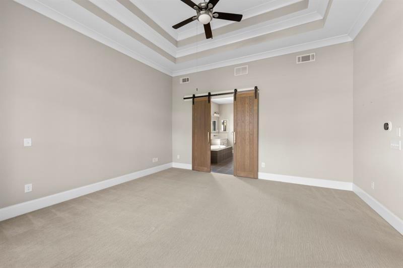 6454 Meridian Way Atlanta, GA 30328 - Photo 24 of 63 an empty room with closet and fan