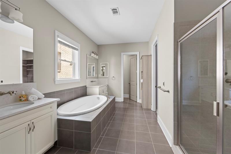 6454 Meridian Way Atlanta, GA 30328 - Photo 25 of 63 a bathroom with a sink toilet and shower