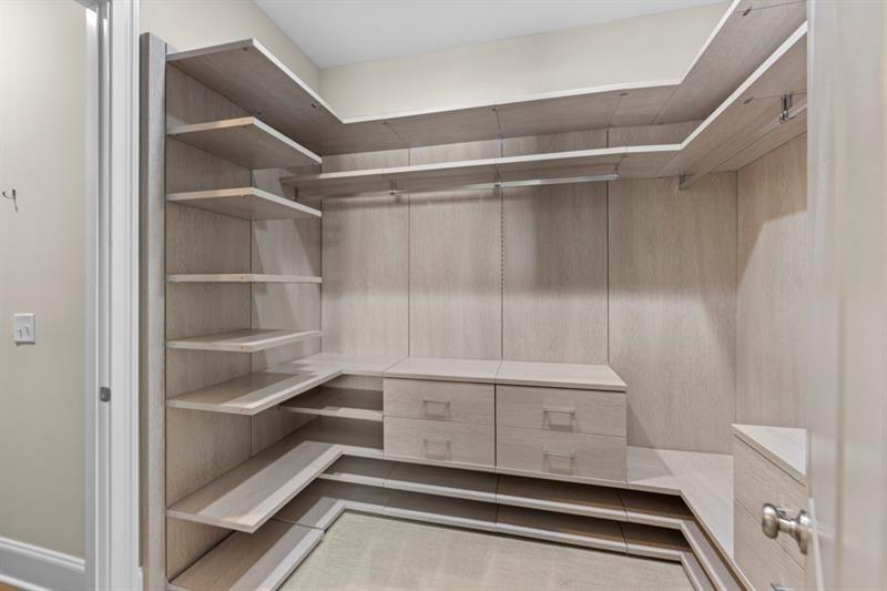 6454 Meridian Way Atlanta, GA 30328 - Photo 26 of 63 a view of walk in closet with empty racks