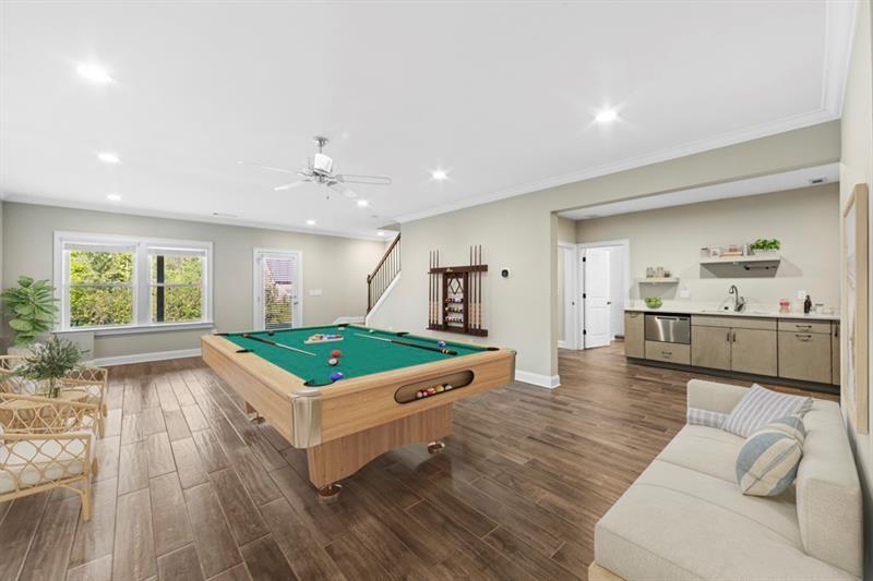 6454 Meridian Way Atlanta, GA 30328 - Photo 42 of 63 a living room with furniture and a wooden floor