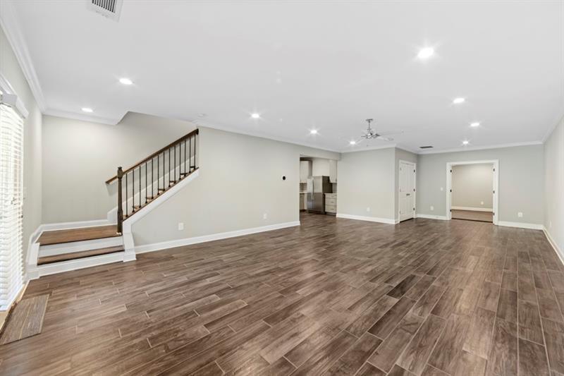 6454 Meridian Way Atlanta, GA 30328 - Photo 43 of 63 a view of an empty room with wooden floor and a window