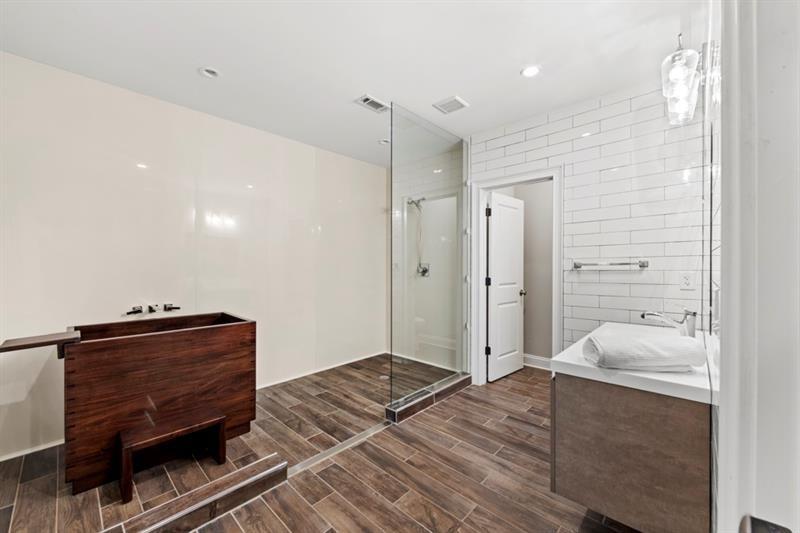 6454 Meridian Way Atlanta, GA 30328 - Photo 46 of 63 a bedroom with a bed and a dresser