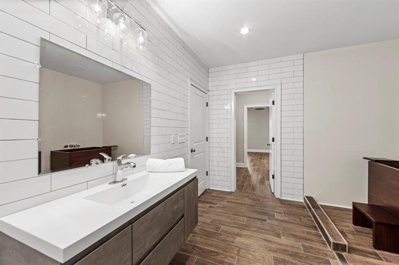6454 Meridian Way Atlanta, GA 30328 - Photo 47 of 63 a bathroom with a sink and a mirror