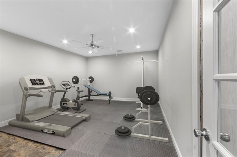 6454 Meridian Way Atlanta, GA 30328 - Photo 50 of 63 a room with gym equipment and gym equipment