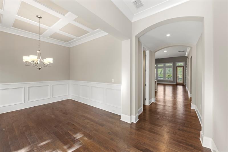 6454 Meridian Way Atlanta, GA 30328 - Photo 5 of 63 wooden floor in an empty room with a window