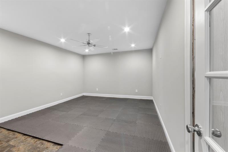 6454 Meridian Way Atlanta, GA 30328 - Photo 51 of 63 an empty room with a empty space and a ceiling fan