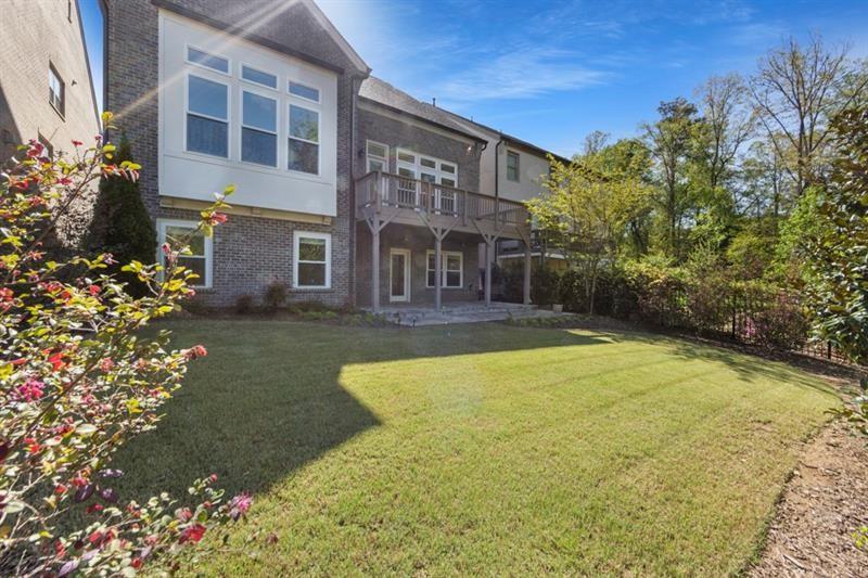 6454 Meridian Way Atlanta, GA 30328 - Photo 55 of 63 a front view of a house with a garden