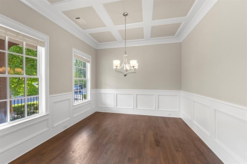 6454 Meridian Way Atlanta, GA 30328 - Photo 6 of 63 wooden floor in an empty room with a window